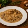 AIP Chicken Stroganoff with mushrooms in creamy coconut sauce, gluten-free, dairy-free, low-inflammatory, autoimmune-friendly comfort food on a rustic table