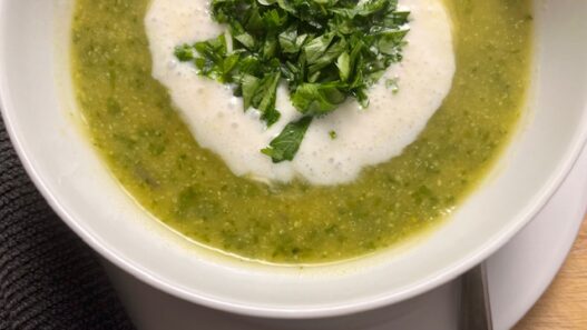 AIP-friendly Acorn Squash and Cauliflower Soup, gluten-free, dairy-free, nightshades-free, gut-healing, served in a bowl with fresh cilantro garnish