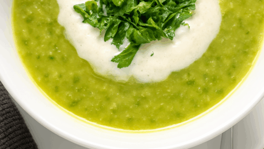 AIP-friendly Acorn Squash and Cauliflower Soup, gluten-free, dairy-free, nightshades-free, gut-healing, served in a bowl with fresh cilantro garnish