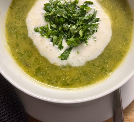 AIP-friendly Acorn Squash and Cauliflower Soup, gluten-free, dairy-free, nightshades-free, gut-healing, served in a bowl with fresh cilantro garnish