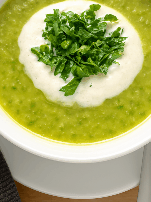 AIP-friendly Acorn Squash and Cauliflower Soup, gluten-free, dairy-free, nightshades-free, gut-healing, served in a bowl with fresh cilantro garnish