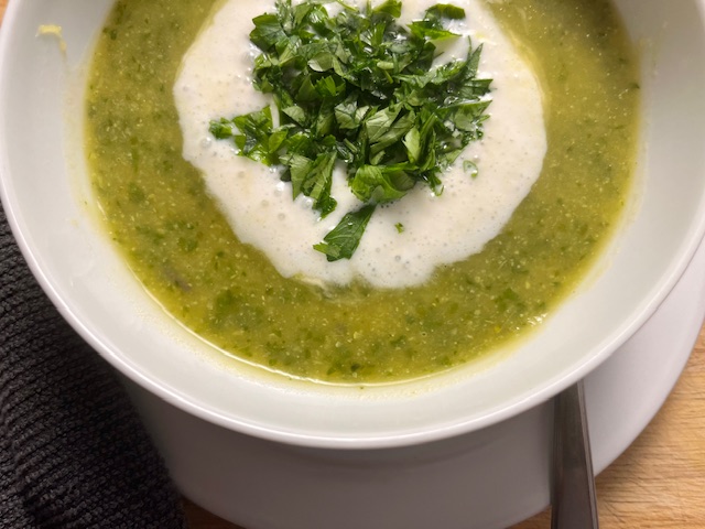 AIP-friendly Acorn Squash and Cauliflower Soup, gluten-free, dairy-free, nightshades-free, gut-healing, served in a bowl with fresh cilantro garnish