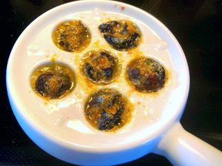 AIP Garlic Escargots served with fresh herbs and a drizzle of olive oil, showcasing a flavorful autoimmune-friendly dish