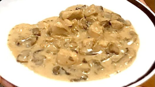 Creamy AIP Chicken Stroganoff with mushrooms, tender chicken, and a dairy-free sauce, served in a rustic dish, perfect for paleo and autoimmune diets.