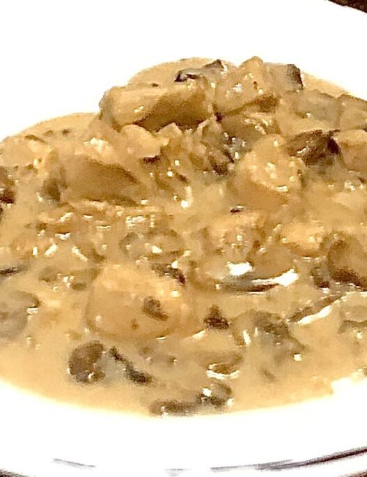 Creamy AIP Chicken Stroganoff with mushrooms, tender chicken, and a dairy-free sauce, served in a rustic dish, perfect for paleo and autoimmune diets.