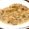 Creamy AIP Chicken Stroganoff with mushrooms, tender chicken, and a dairy-free sauce, served in a rustic dish, perfect for paleo and autoimmune diets.