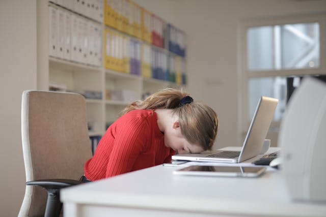 A person lying down, visibly fatigued, reflecting the exhaustion common with autoimmune diseases like fatigue and muscle weakness