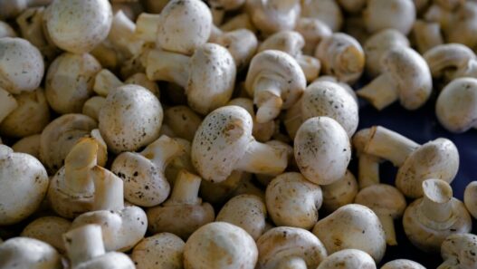 Cleaning and peeling mushrooms for AIP recipes to enhance texture and presentation.