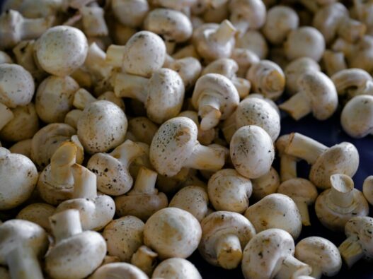 Cleaning and peeling mushrooms for AIP recipes to enhance texture and presentation.