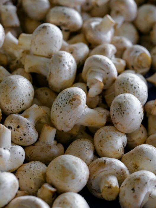 Cleaning and peeling mushrooms for AIP recipes to enhance texture and presentation.