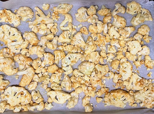 Roasted cauliflower with garlic and turmeric, all ingredients ready to be baked in the oven, anti-inflammatory dish perfect for AIP and gluten-free diets.