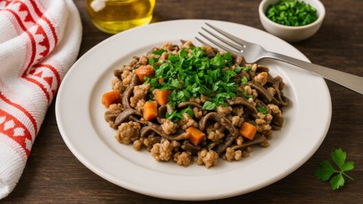 AIP Pasta Bolognese with ground turkey, carrots, and fresh parsley on a white plate; gluten-free, dairy-free, autoimmune-friendly meal