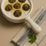 AIP Garlic Escargots served with fresh herbs and a drizzle of olive oil, showcasing a flavorful autoimmune-friendly dish