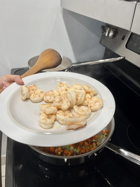 Cooked shrimp on a plate, golden and tender, ready to be added to the AIP-friendly Garlic Shrimp Cassava Orzo.