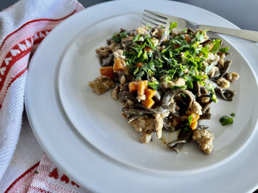 Healthy AIP-friendly Pasta Bolognese served with green banana fusilli pasta, featuring a no-tomato sauce for a gluten-free, nightshade-free, gut-friendly meal.