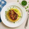AIP Pork and Cabbage Steaks served on a white plate with fresh parsley, gluten-free, dairy-free, nutrient-dense AIP dinner, perfect for autoimmune diet recipes.