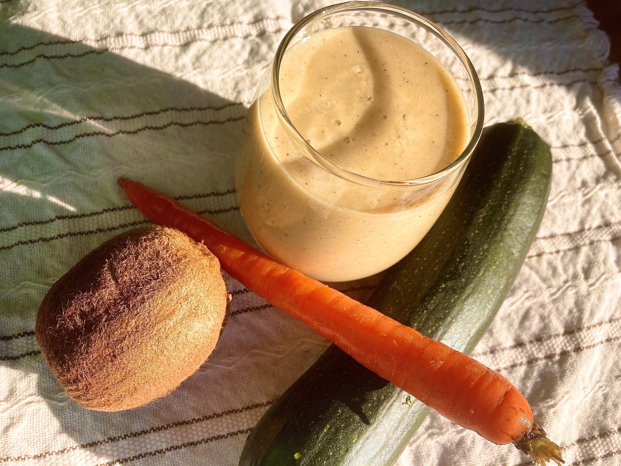 Kiwi, carrot, zucchini smoothie with coconut yogurt and ginger, an AIP breakfast or snack, rich in vitamins, minerals, antioxidants and probiotics.