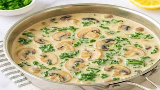 Mushroom Kale Sauce in Creamy Coconut Base with sautéed mushrooms and wilted kale in a dairy-free, gluten-free, paleo, AIP-friendly creamy coconut sauce