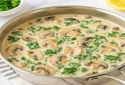 Mushroom Kale Sauce in Creamy Coconut Base with sautéed mushrooms and wilted kale in a dairy-free, gluten-free, paleo, AIP-friendly creamy coconut sauce