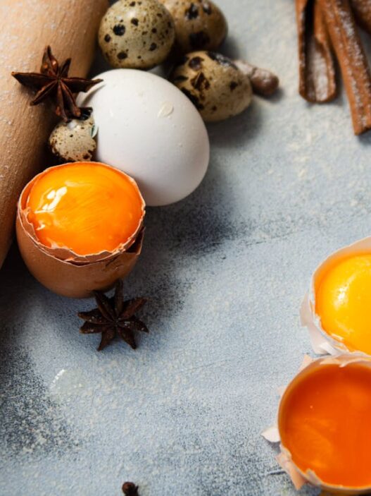 Fresh egg yolks inside their shells, showcasing vibrant color and smooth texture, perfect for Stage 1 Reintroduction phase recipes