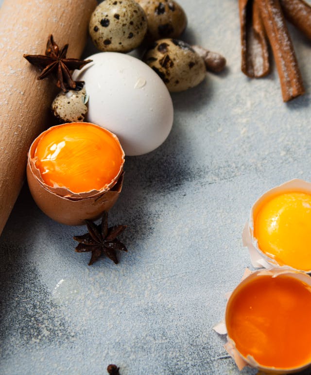 Fresh egg yolks inside their shells, showcasing vibrant color and smooth texture, perfect for Stage 1 Reintroduction phase recipes