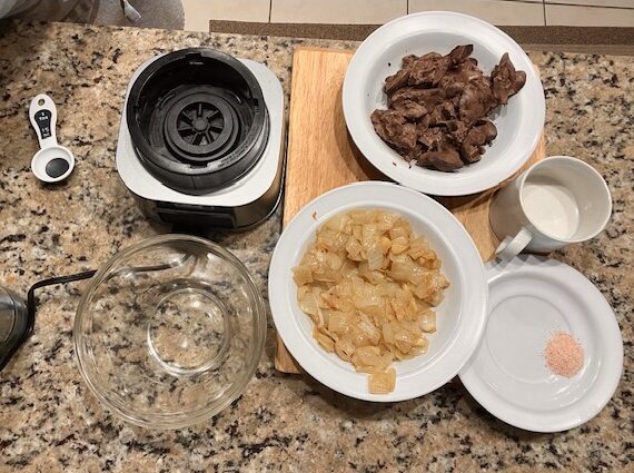 All ingredients for AIP Chicken Liver Pâté ready to blend, including chicken livers, coconut milk, onions, and thyme.