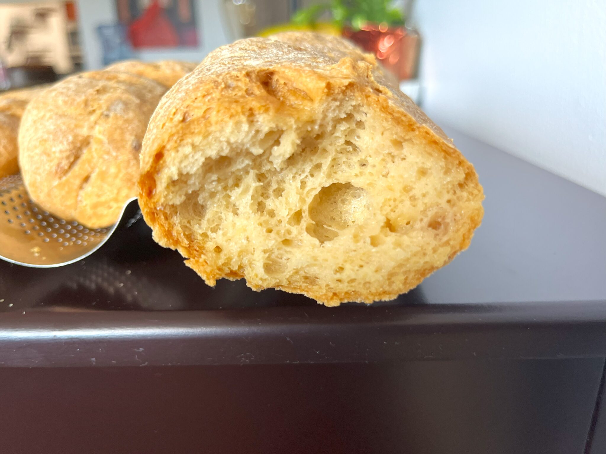 Freshly baked Gluten-free French Baguette with a golden crust, free from eggs, dairy, and gluten, perfect for those with dietary restrictions.