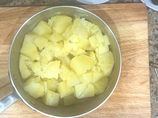 Ghee Mashed Sweet Potatoes - Cubed sweet potatoes boiling, perfect for AIP reintroduction, nightshades-free, and a healthy side dish.