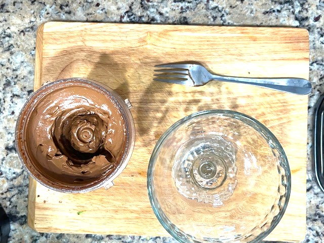 Processed Cacao Avocado Pudding mixture, smooth and creamy, ready to be served in a glass cup. Gluten-free, dairy-free, nut-free, and AIP reintroduction-friendly.