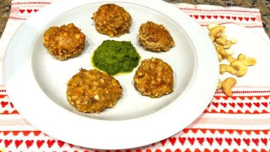 Cashew veggie meatballs served on a plate with kale pesto in the center, perfect for AIP, gluten-free, and plant-based diets.