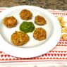 Cashew veggie meatballs served on a plate with kale pesto in the center, perfect for AIP, gluten-free, and plant-based diets.