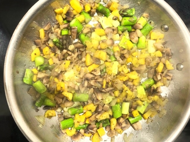 Cooked ingredients for Egg White Veggie Wrap with Mushrooms, Asparagus, Yellow Squash, and Herbs in a pan – sautéed mushrooms, asparagus, yellow squash, and onion with thyme, oregano, and avocado oil. Gluten-free, dairy-free, paleo, Whole30, and AIP-friendly recipe.