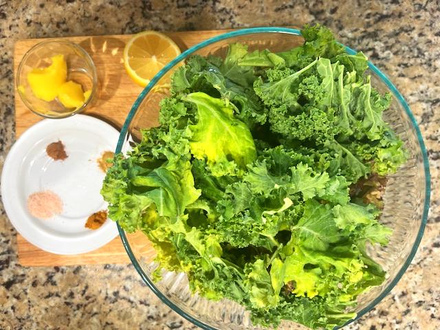 Kale Sauteed with cumin and ghee ingredients. Kale, ghee, cumin, cinnamon, turmeric, and fresh lemon come together for a flavorful meal.