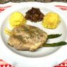 Ghee mashed sweet potatoes with pork chop on a plate, AIP-compliant meal