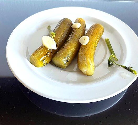 Homemade AIP Pickles with garlic, dill, and horseradish, fermented for a healthy, probiotic-rich snack