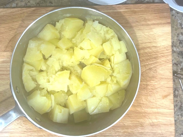 Boiling sweet potatoes for AIP-Friendly Plum Dumplings. A simple step to prepare for a gluten, dairy, nut, and nightshade-free dessert suitable for egg reintroduction.