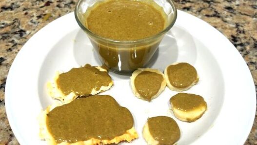 Pumpkin Seed Butter spread on AIPcrackers and banana rounds for a healthy, nut-free snack.