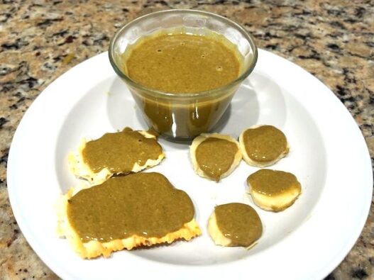 Pumpkin Seed Butter spread on AIPcrackers and banana rounds for a healthy, nut-free snack.