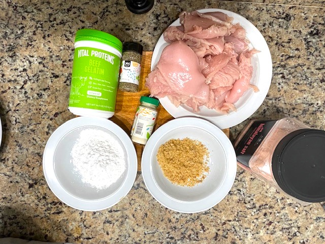 Ingredients for the Tastiest Chicken Breast Schnitzel, including chicken breast, pork rinds, tapioca flour, and seasonings – all gluten-free, dairy-free, and egg-free.