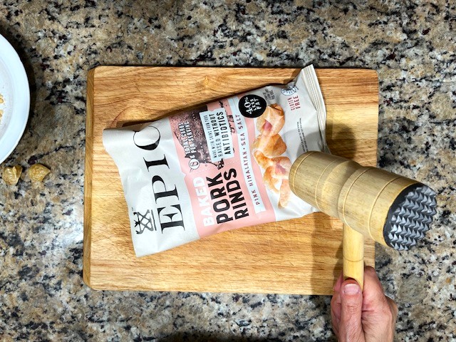 Preparing pork rinds and tapioca flour for the coating of the Tastiest Chicken Breast Schnitzel, a gluten-free, dairy-free, egg-free recipe.