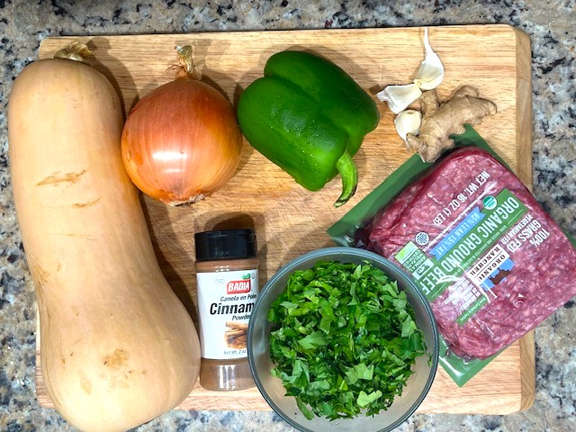 Ingredients for Savory Stuffed Butternut Squash, including butternut squash, ground meat, green pepper, onion, garlic, and ginger. AIP reintroduction, gluten-free, dairy-free.