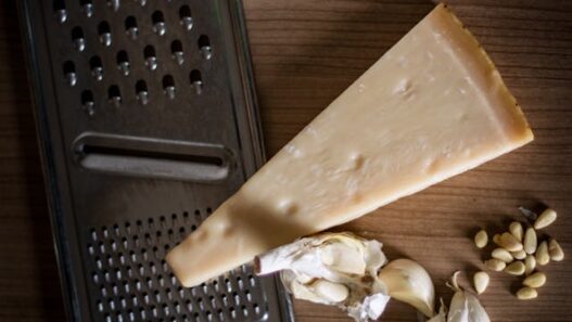 Grass-fed butter and Parmesan being shredded for a recipe