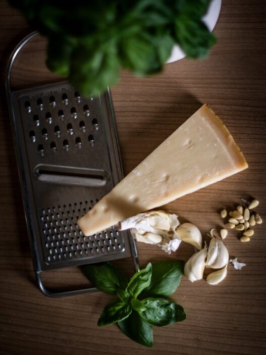 Grass-fed butter and Parmesan being shredded for a recipe