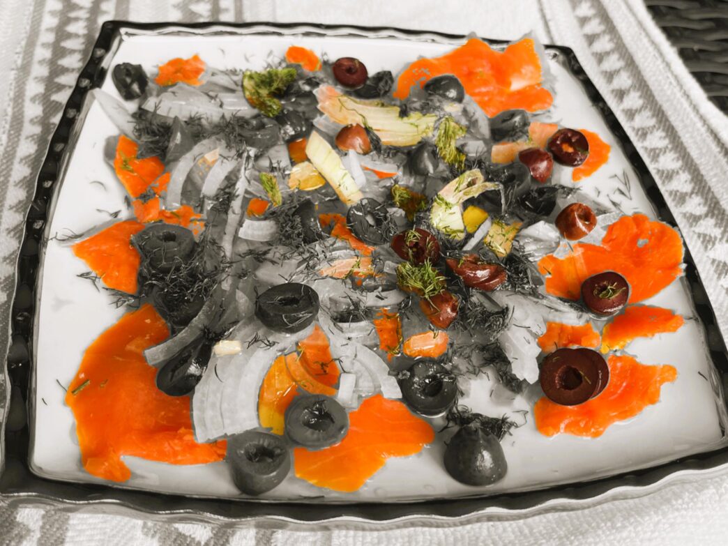 smoked salmon plate, AIP appetizer, with anti-inflammatory ingredients including onions, black olives, fresh dill, olive oil, and apple cider vinegar – perfect for autoimmune and paleo diets.