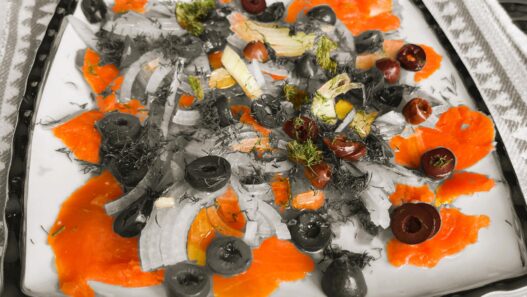 smoked salmon plate, AIP appetizer, with anti-inflammatory ingredients including onions, black olives, fresh dill, olive oil, and apple cider vinegar – perfect for autoimmune and paleo diets.