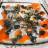 smoked salmon plate, AIP appetizer, with anti-inflammatory ingredients including onions, black olives, fresh dill, olive oil, and apple cider vinegar – perfect for autoimmune and paleo diets.