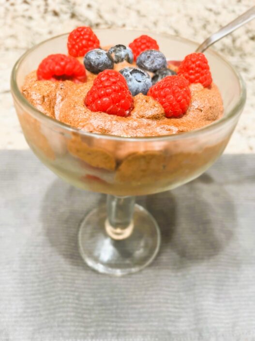 Aquafaba Chocolate Mousse in a cup topped with fresh blueberries and raspberries – vegan, dairy-free, AIP-friendly, anti-inflammatory dessert.