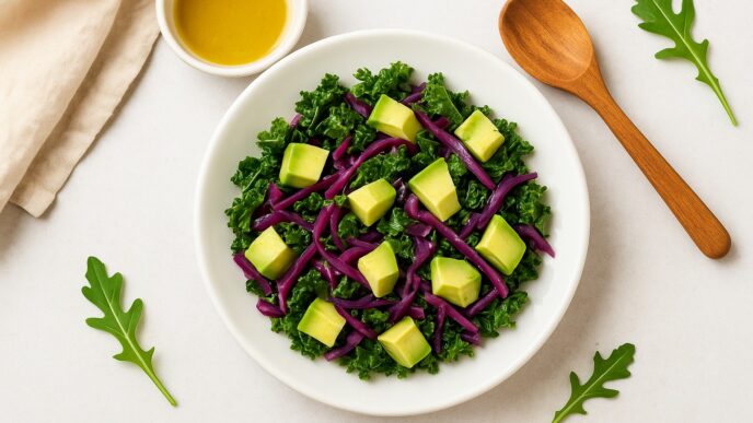 Kale and cabbage salad with avocado cubes and purple cabbage strips, an anti-inflammatory, IBS-friendly, low-oxalate, nightshade-free, gluten-free, dairy-free, and gut-healing dish.