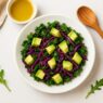 Kale and cabbage salad with avocado cubes and purple cabbage strips, an anti-inflammatory, IBS-friendly, low-oxalate, nightshade-free, gluten-free, dairy-free, and gut-healing dish.