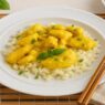 AIP Thai Coconut Chicken served on cauliflower rice, garnished with basil, gluten free, dairy free, soy free, nightshade free, Paleo dinner.